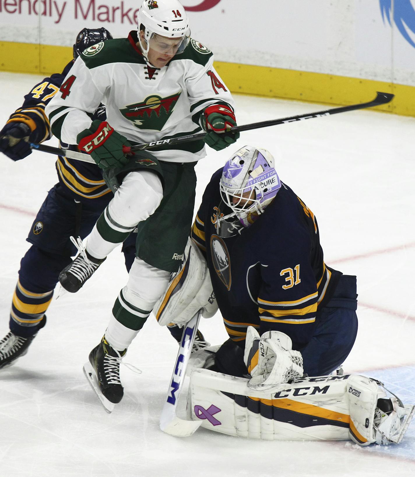 Minnesota Wild center Joel Eriksson Ek (14) screens Buffalo Sabres goalie Anders Nilsson (31) during the second period of an NHL hockey game, Thursday, Oct. 27, 2016, in Buffalo, N.Y. (AP Photo/Jeffrey T. Barnes)