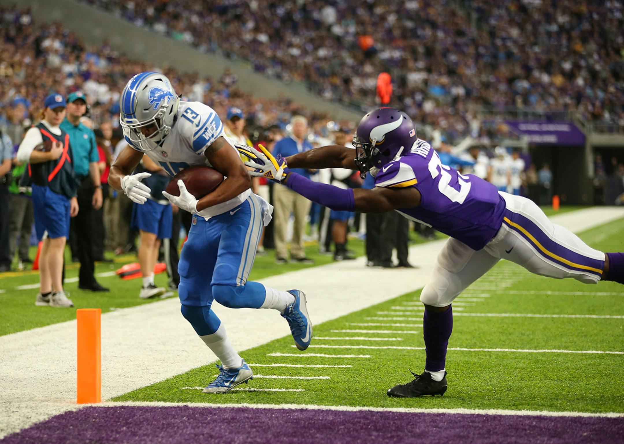 Detroit Lions wide receiver T.J. Jones (13) caught a pass in front of Minnesota Vikings cornerback Xavier Rhodes (29) for a successful two point conversion in the third quarter.