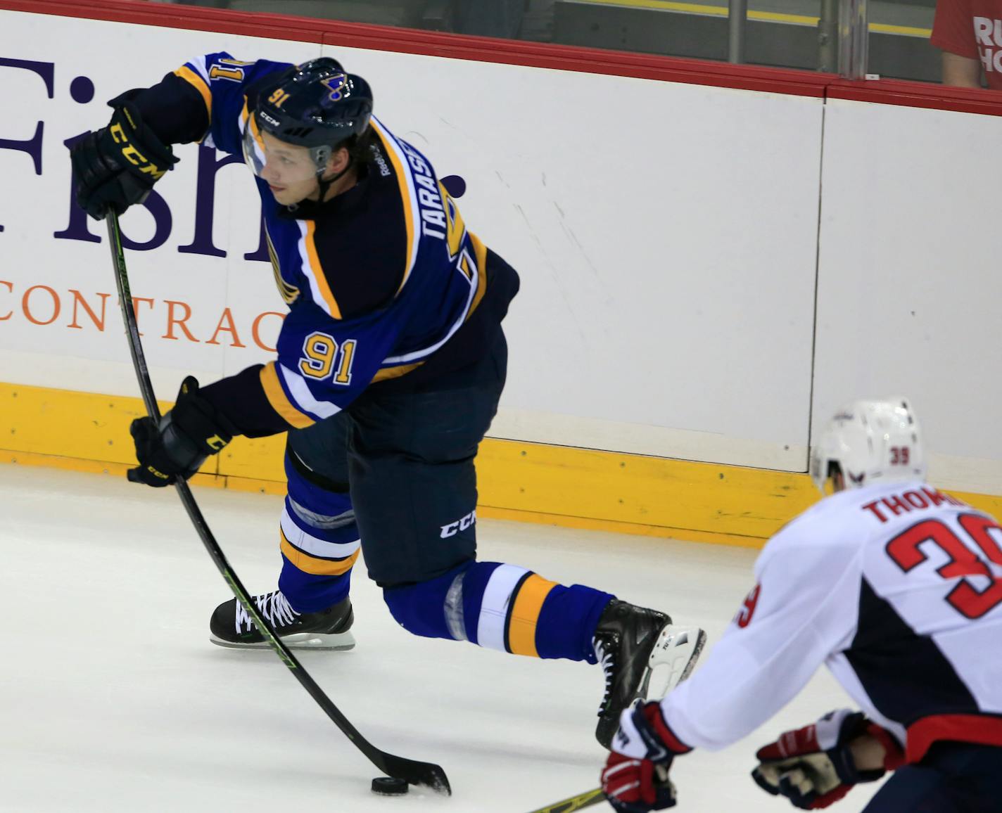 St. Louis Blues right wing Vladimir Tarasenko (91) shoots after getting past Washington Capitals left wing Christian Thomas (39) during the second period of an NHL preseason hockey game in Kansas City, Mo., Wednesday, Oct. 5, 2016. (AP Photo/Orlin Wagner)