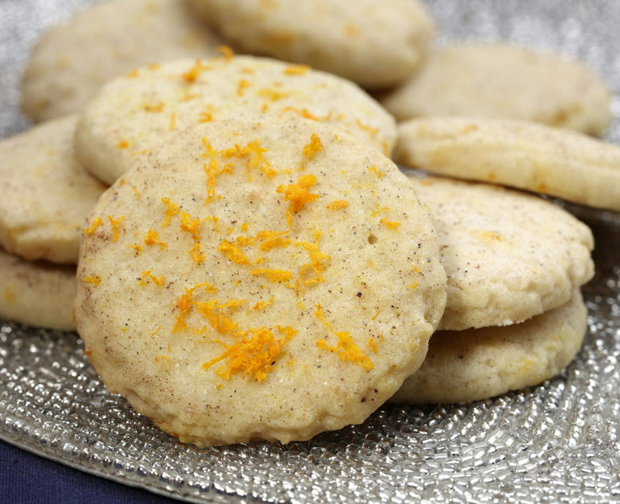 Cardamom Orange Zest Sugar Cookies (from baker Jeanne Nordstrom) ] The winner and four finalists in the 2015 Taste Holiday Cookie (Cooky) Contest: Chocolate Decadence Cookies (from baker Elaine Prebonich), Kit Kat Christmas Bars (from baker Julie Olson), Cardamom Orange Zest Sugar Cookies (from baker Jeanne Nordstrom), Bacon Cornmeal Venetos (by bakers Julie Bollmann, Wendy Kleiser, Joan Koller, Geri Olson and Mary Urbas) and winner Apple Cardamom Pecan Star Cookies (from baker Jana Freiband).
