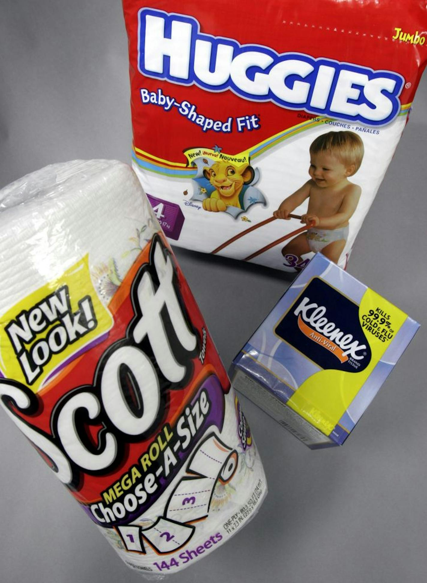 Three of Kimberly-Clark Corp. products are shown April 24, 2006 in a Farmers Branch, Texas file photo. Kimberly-Clark Corp., which makes Kleenex tissues and Huggies diapers, said its second-quarter profit fell as rising costs for energy and raw materials offset a 4 percent increase in revenue.