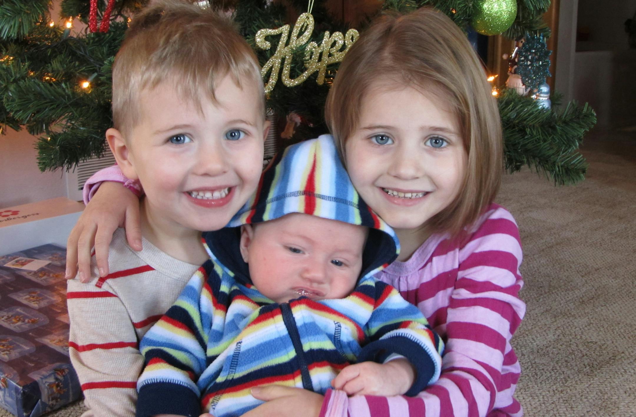 Jocelyn, right, with brothers Reid, left, and Liam.
