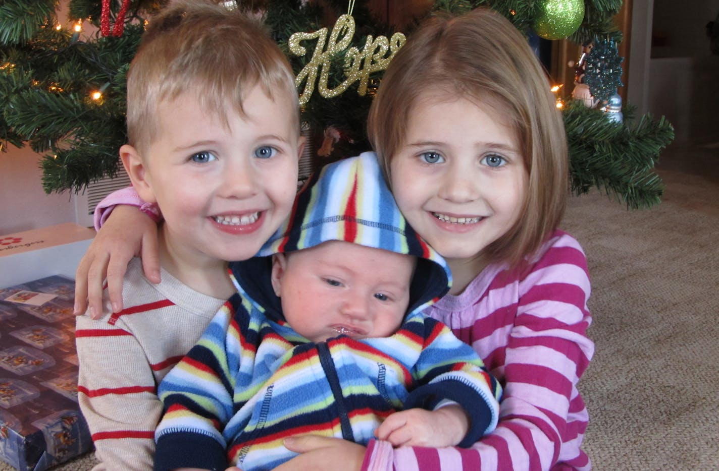 Jocelyn, right, with brothers Reid, left, and Liam.