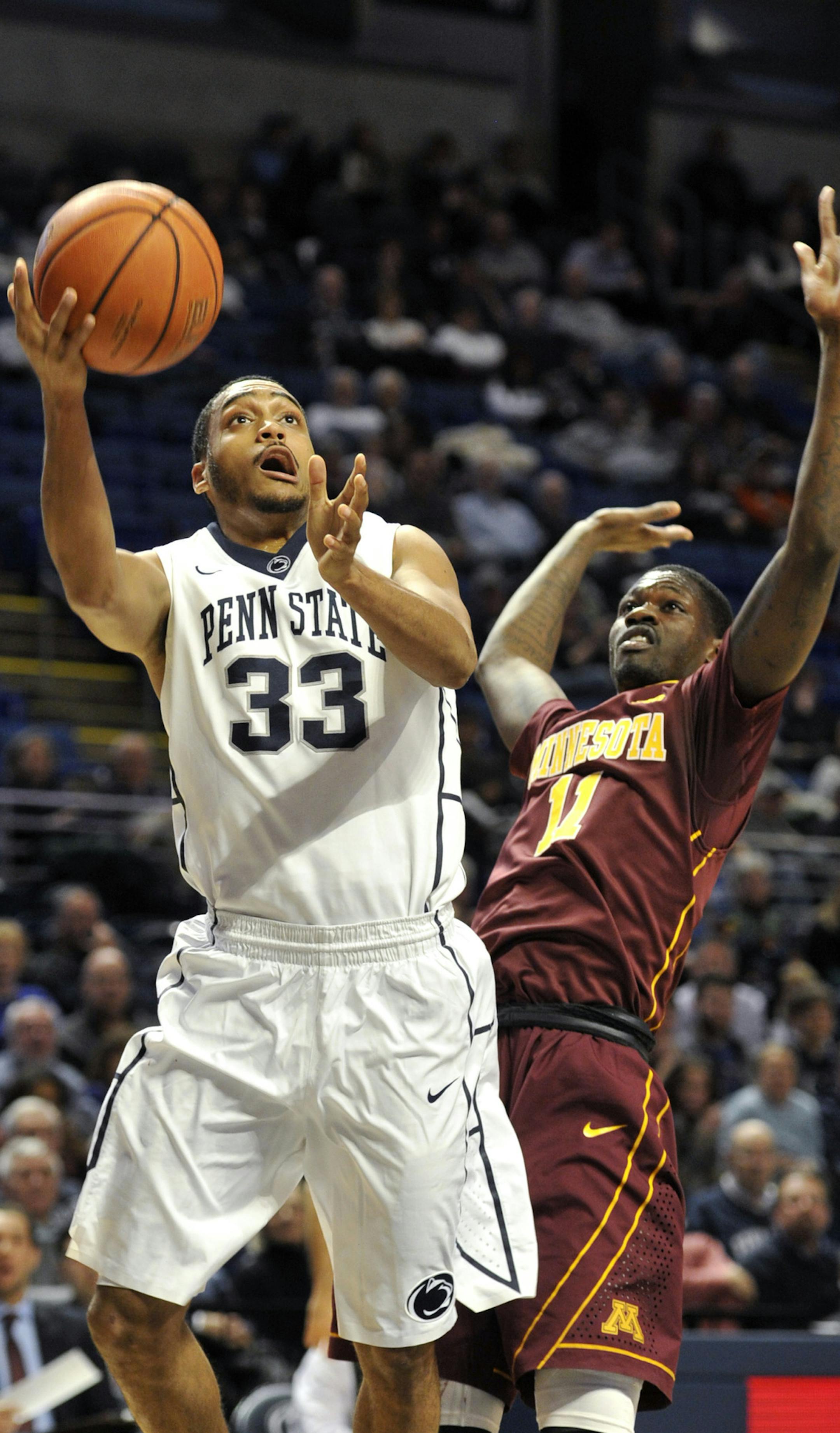 Penn State's Shep Garner (33) drives past Minnesota's Carlos Morris during an NCAA college basketball game, Tuesday, Jan. 5, 2016 in University Park, Pa. (Nabil K. Mark/Centre Daily Times via AP) MANDATORY CREDIT; MAGS OUT