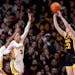 Gophers defenders arrived too late to stop Hawkeyes star Caitlin Clark from shooting and making a three-pointer in the second quarter of Iowa's 108-60