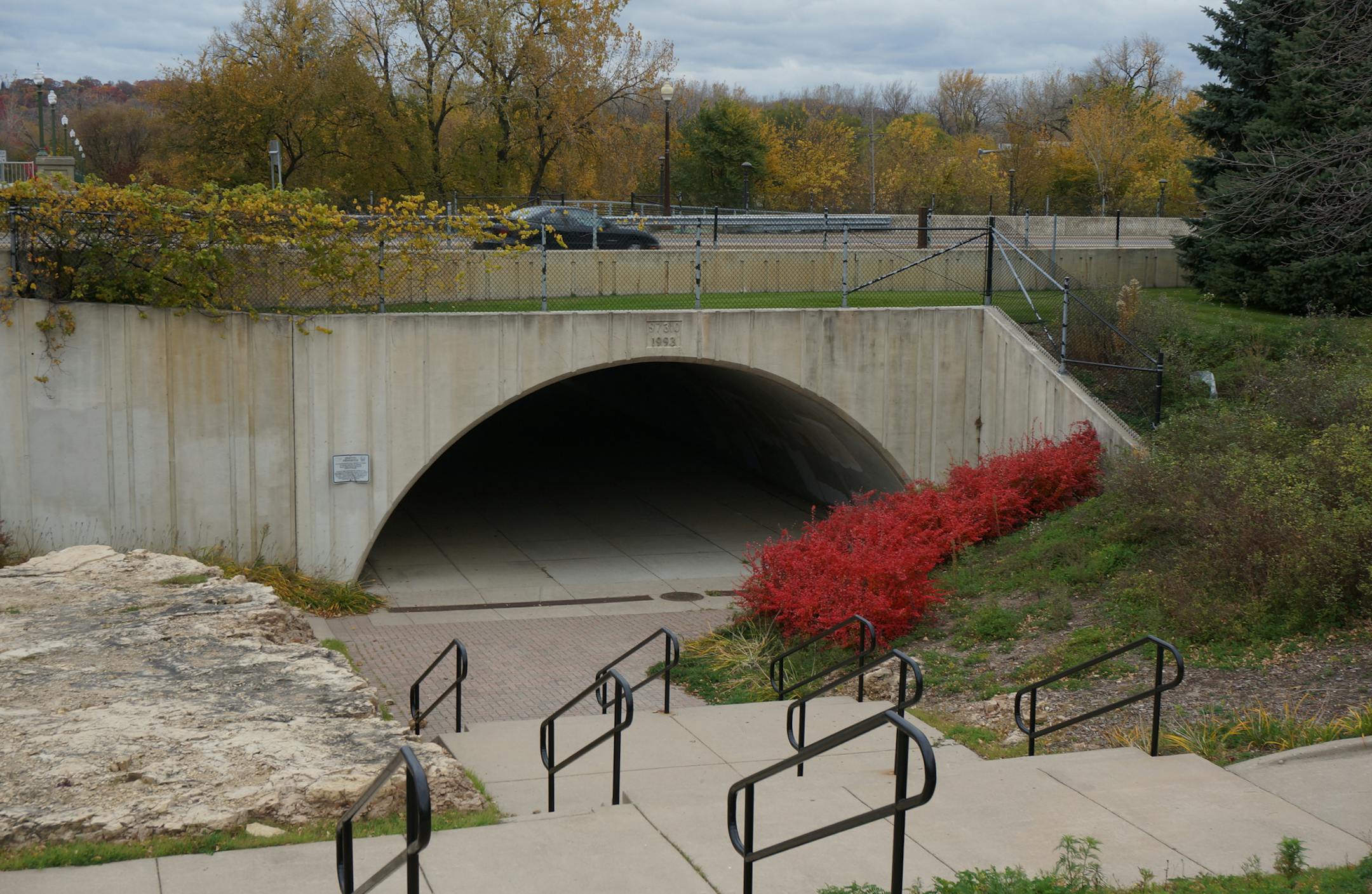 John Schroers is working with the Shakopee Chamber and Visitors Bureau on a 1,000-square-foot mural that will run along the retaining wall that separates the city's downtown from the Minnesota River and through the Holmes Street pedestrian tunnel. The tunnel as it looks today. Photo by Dylan Peers McCoy, Special to the Star Tribune