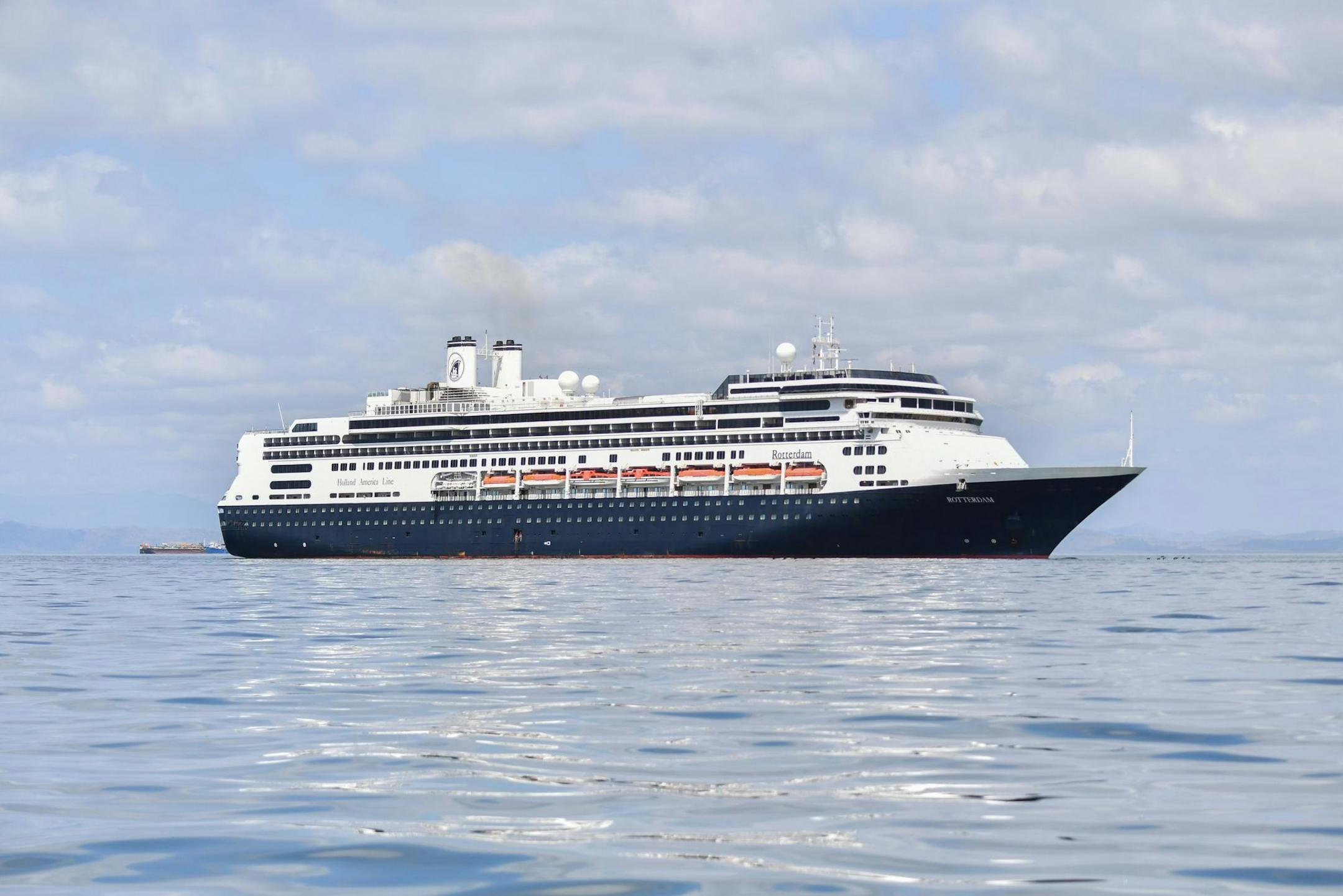 The Rotterdam cruise ship waits berthed to assist the Zaandam cruise ship with supplies, personnel and COVID-19 testing devices, at 8 milles from Panama City, on March 27, 2020. - Panama allowed medical assistance at sea for the Zaandam cruise ship with dozens of people with flu symptoms on board amid the coronavirus pandemic outbreak. (Luis Acosta/AFP via Getty Images)