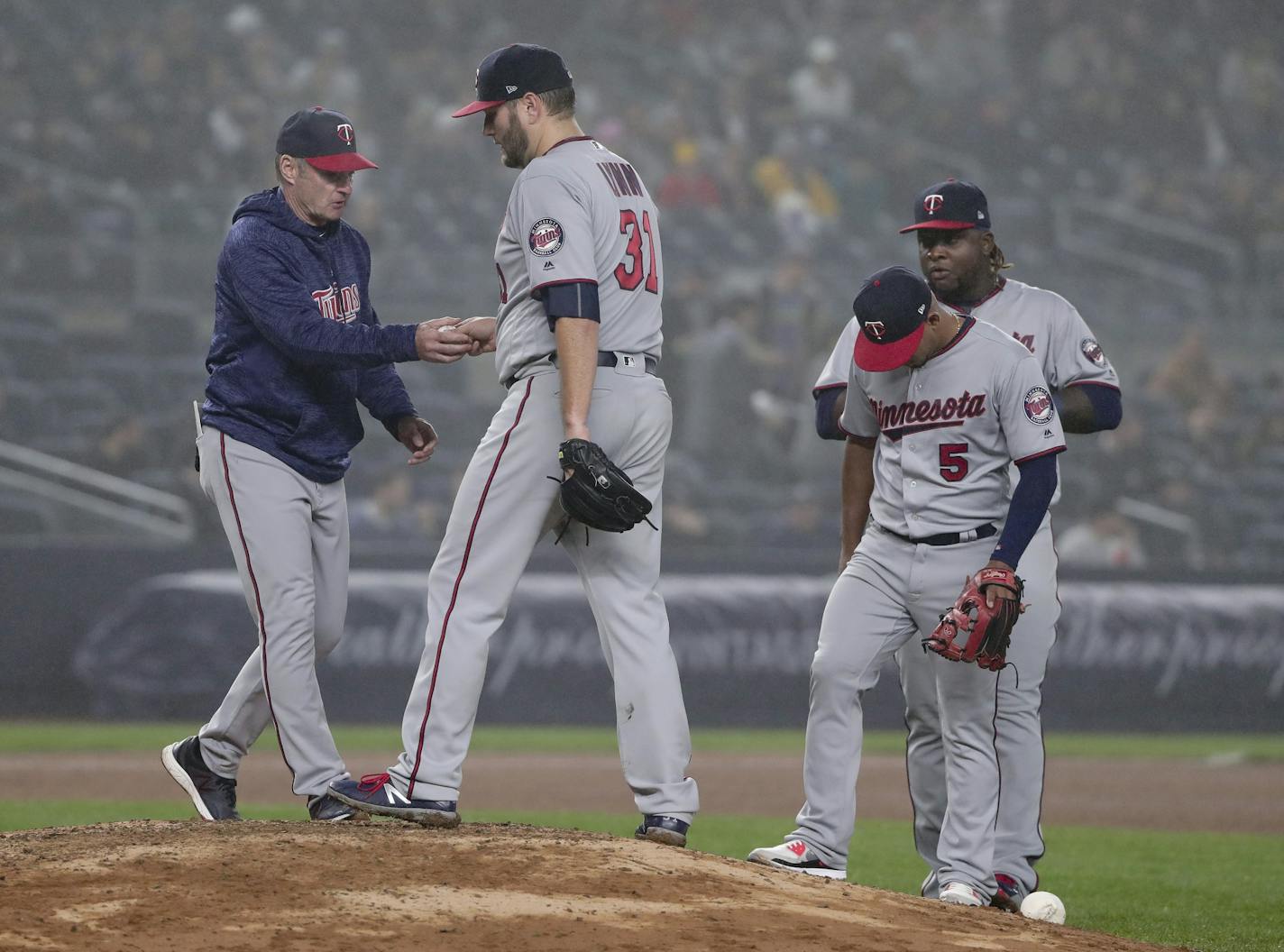 Minnesota Twins pitcher Lance Lynn (31) hands the ball to manager Paul Molitor as he leaves the game during the fourth inning of a baseball game against the New York Yankees, Wednesday, April 25, 2018, in New York.