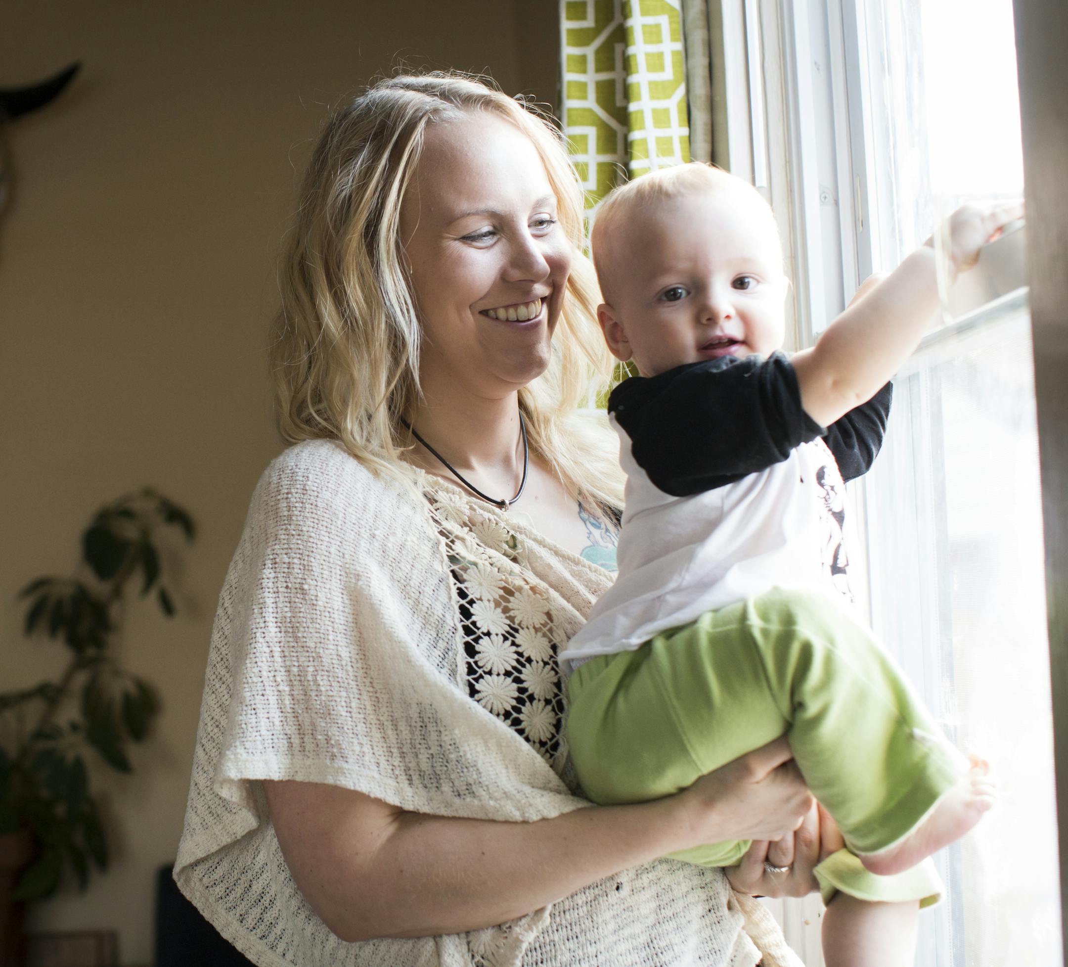 Ariel Landsberger held her son Sonney at her home in Minneapolis, Minn., on Tuesday, November 4, 2014. The young Minneapolis mom started a social media campaign on Instagram to normalize breastfeeding in public a few months ago. ] RENEE JONES SCHNEIDER • reneejones@startribune.com