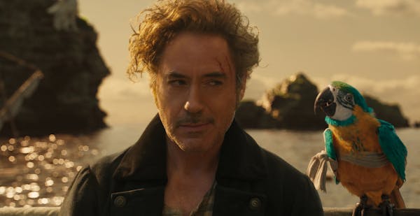 (from left) Dr. John Dolittle (Robert Downey Jr.) and parrot Polynesia (Emma Thompson) in "Dolittle," directed by Stephen Gaghan.