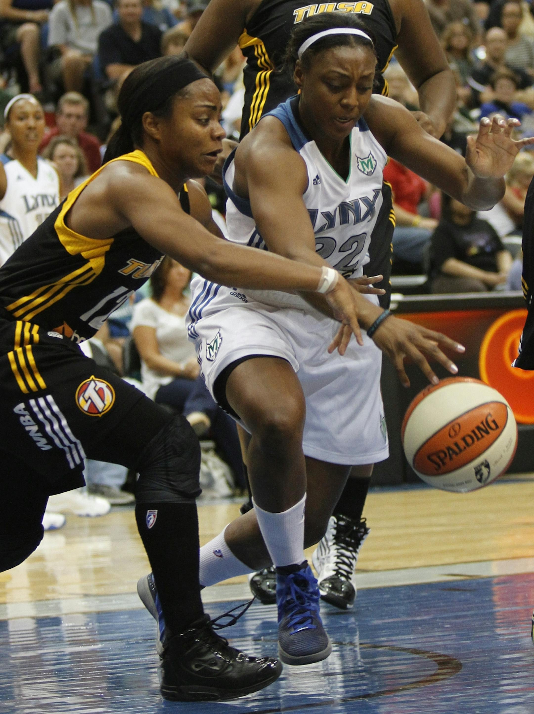Lynx Monica Wright fought for possession of the ball in the paint with Shock's Ivory Latta during second half action at the Target Center in Minneapolis, Min., Friday August 31, 2012. Lynx won over the Shock 92-83.