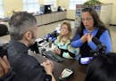 Rowan County Clerk Kim Davis, right, talks with David Moore following her office's refusal to issue marriage licenses at the Rowan County Courthouse i