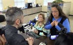 Rowan County Clerk Kim Davis, right, talks with David Moore following her office's refusal to issue marriage licenses at the Rowan County Courthouse i