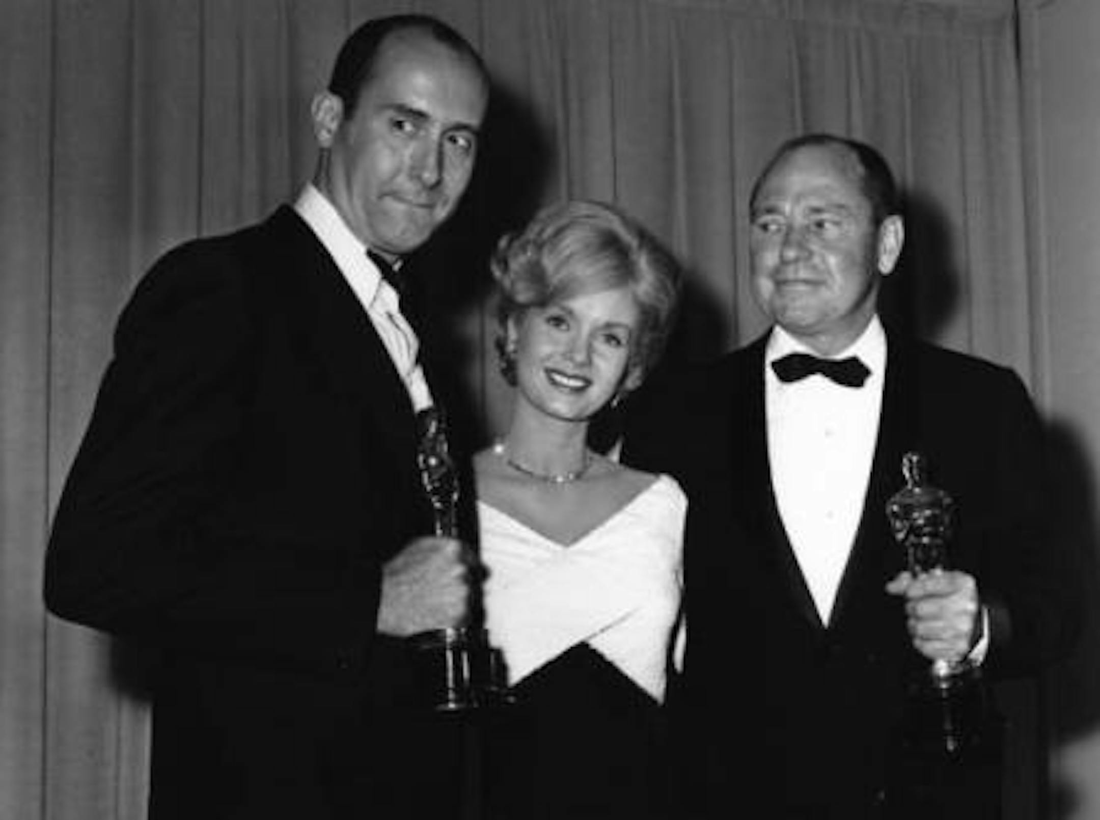 Debbie Reynolds was the presenter in 1962 when Henry Mancini (Left) and Johnny Mercer won Oscars for "Moon River" from "Breakfast at Tiffany's." Image: Associated Press.