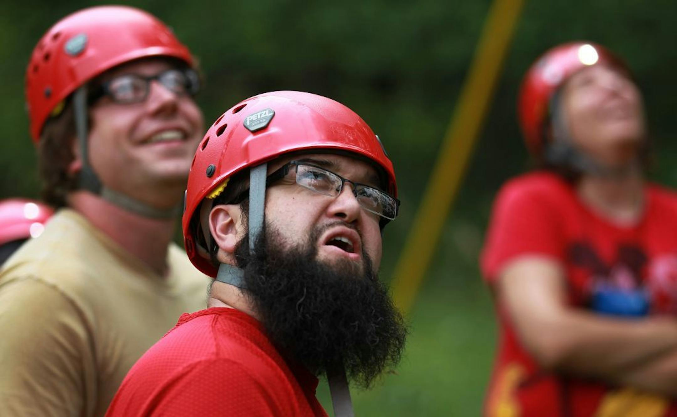 Mohammad Zafar teamed up with students at Metro State University during the ropes challenge at Camp Friendship. This activity allows students to work on team building, problem-solving and personal goals .