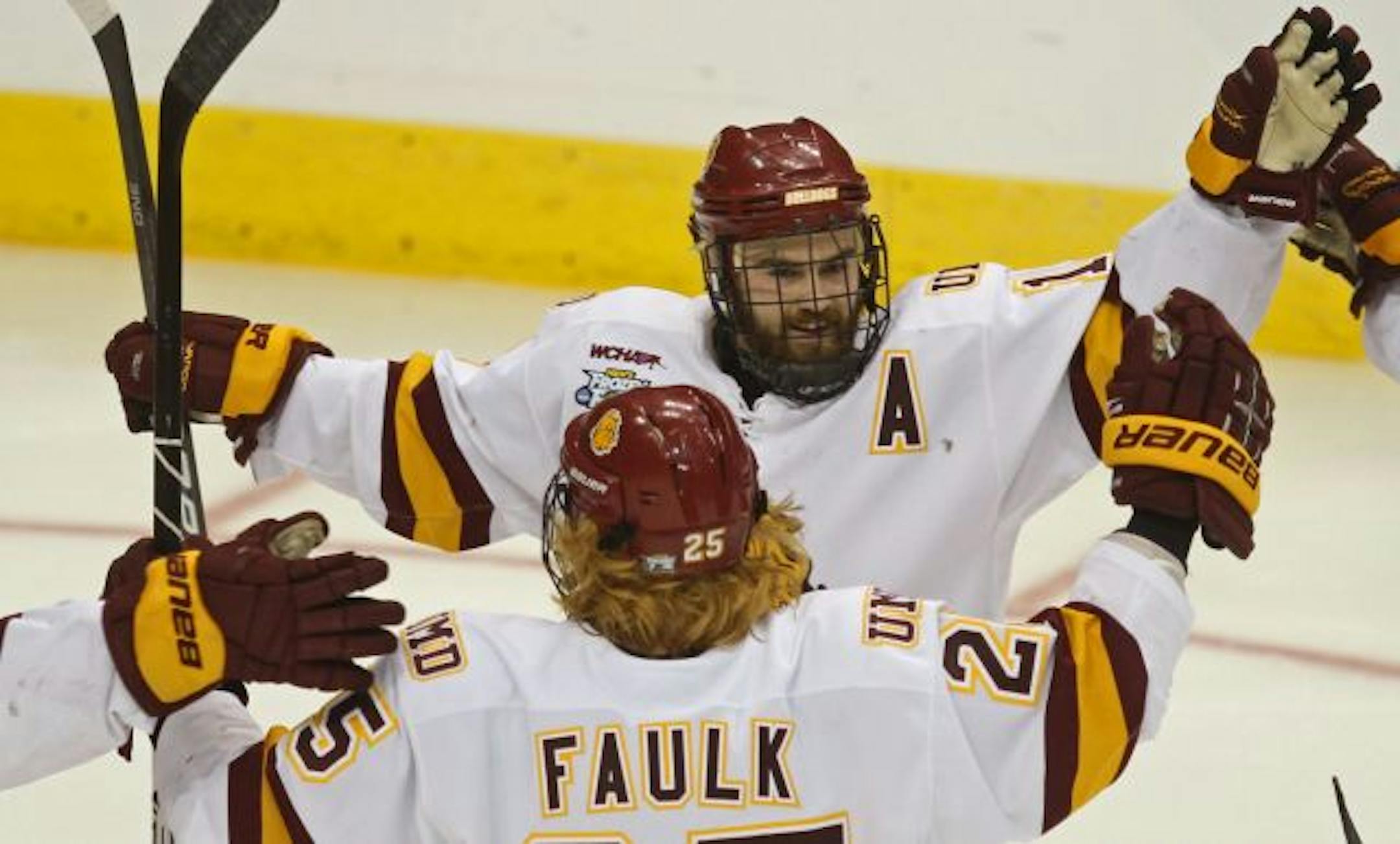 NCAA Frozen Four Semifinals, Minnesota Duluth vs Notre Dame. (left to right) Justin Faulk celebrated with Jack Connolly after Connolly scored a Bulldog goal against Notre Dame.