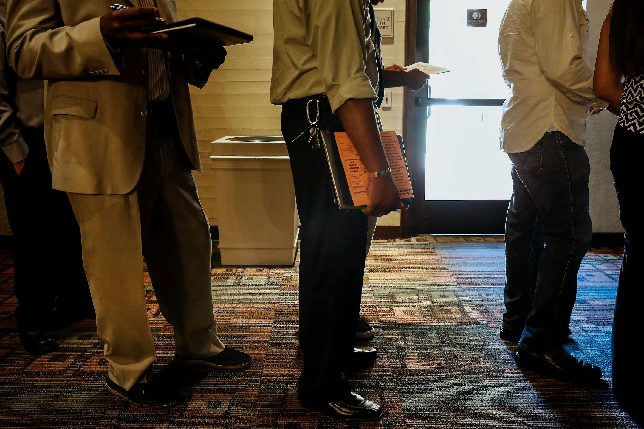 Job seekers wait in line to speak with recruiters at the Career Choice Inland Empire Career Fair in Ontario, California, U.S., on Wednesday, Sept. 10, 2014. The U.S. Department of Labor is scheduled to release intial jobless claims figures on Sept. 11, 2014. Photographer: Patrick T. Fallon/Bloomberg