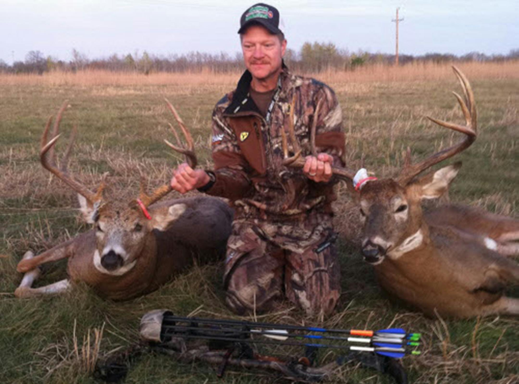 Luke Hegge, 33, of Pine City, showed off two 10-point bucks he arrowed at Camp Ripley on Oct. 20, 2011. The green score of the deer on the left was 160; the one on the right scored 155. He was hunting with a friend, and used his friend's tag for the second deer. ORG XMIT: MIN2015101613014422
