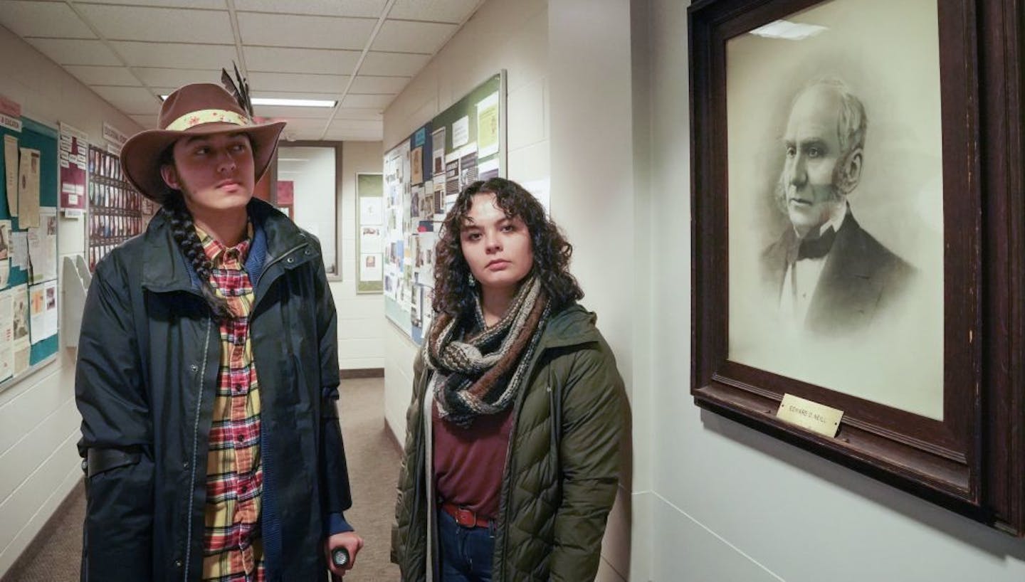 Jennings Mergenthal and Zoe Allen, co-chairs of Proud Indigenous People for Education (PIPE) stood near a portrait of Edward Neill in Neill Hall. They object to the naming of Neill Hall. The naming of Neill Hall, the Arts and Humanities Building at Macalester, is now under fire, because it's named after a man that had some writings perceived to be racist.