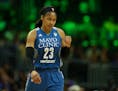 Minnesota Lynx forward Maya Moore (23) pumped her fist as she headed to the bench for a second half timeout.