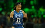 Minnesota Lynx forward Maya Moore (23) pumped her fist as she headed to the bench for a second half timeout.