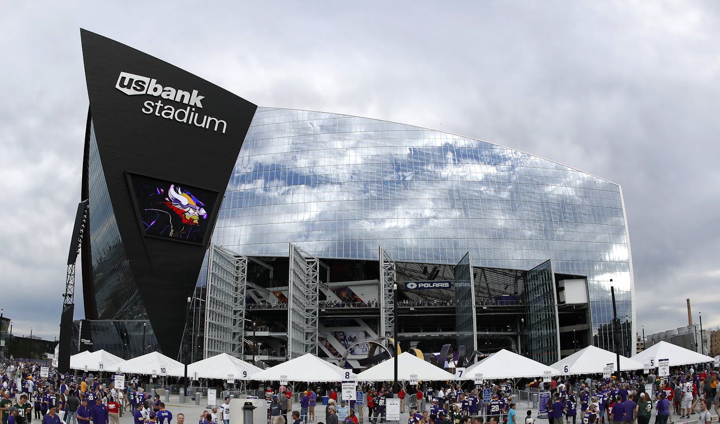 Fans outside of US bank Stadium before Sunday night's game between the Minnesota Vikings and Green Bay Packers. ] CARLOS GONZALEZ cgonzalez@startribune.com - September 18, 2016, Minneapolis, MN, US Bank Stadium, NFL, Minnesota Vikings vs. Green Bay Packers ORG XMIT: MIN1609181847420822