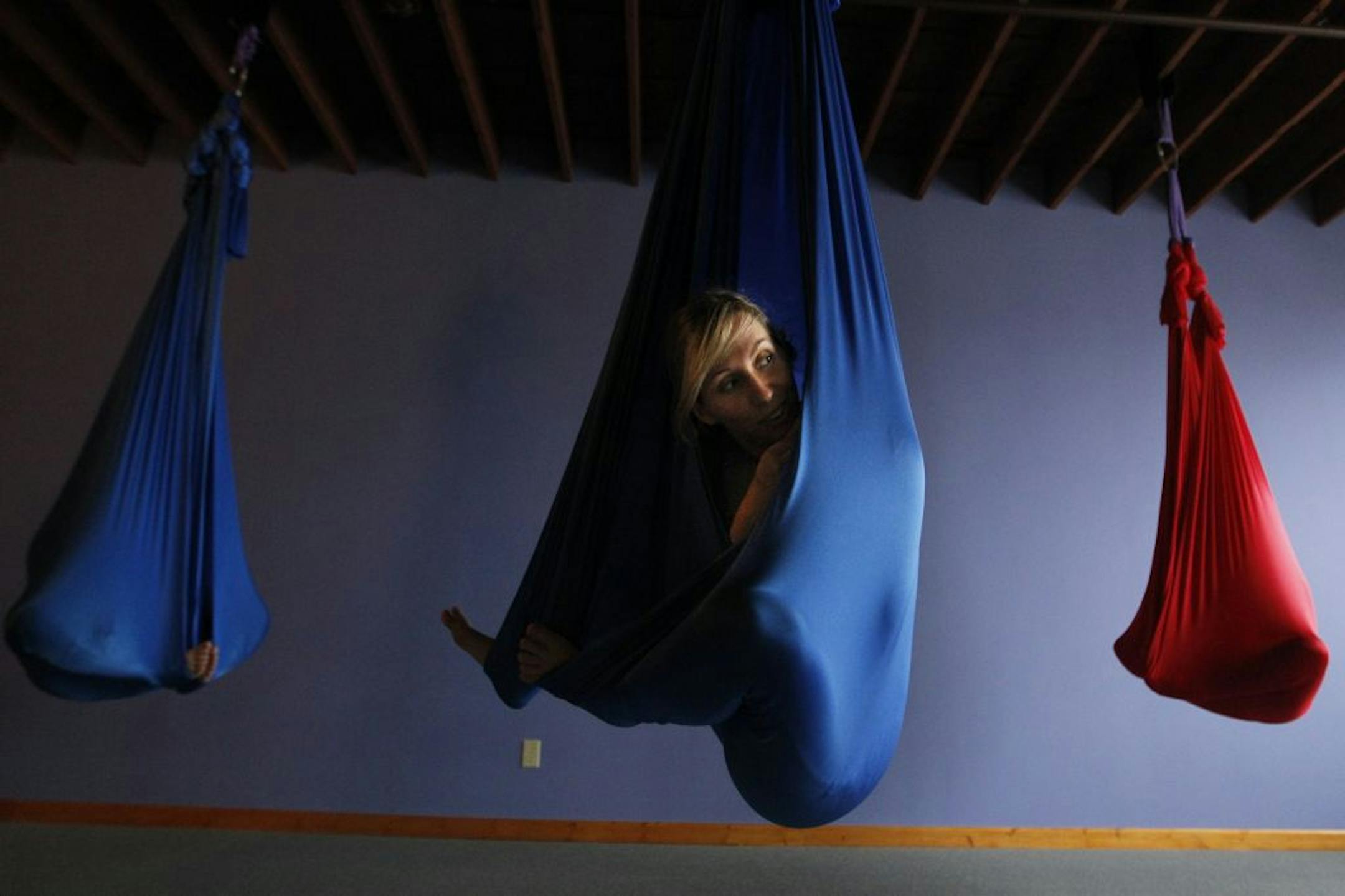 In the aerial yoga class at the Yoga Center of Minneapolis, Becky Stella, center, has been teaching this type of yoga in Minnesota since the winter of 2010.