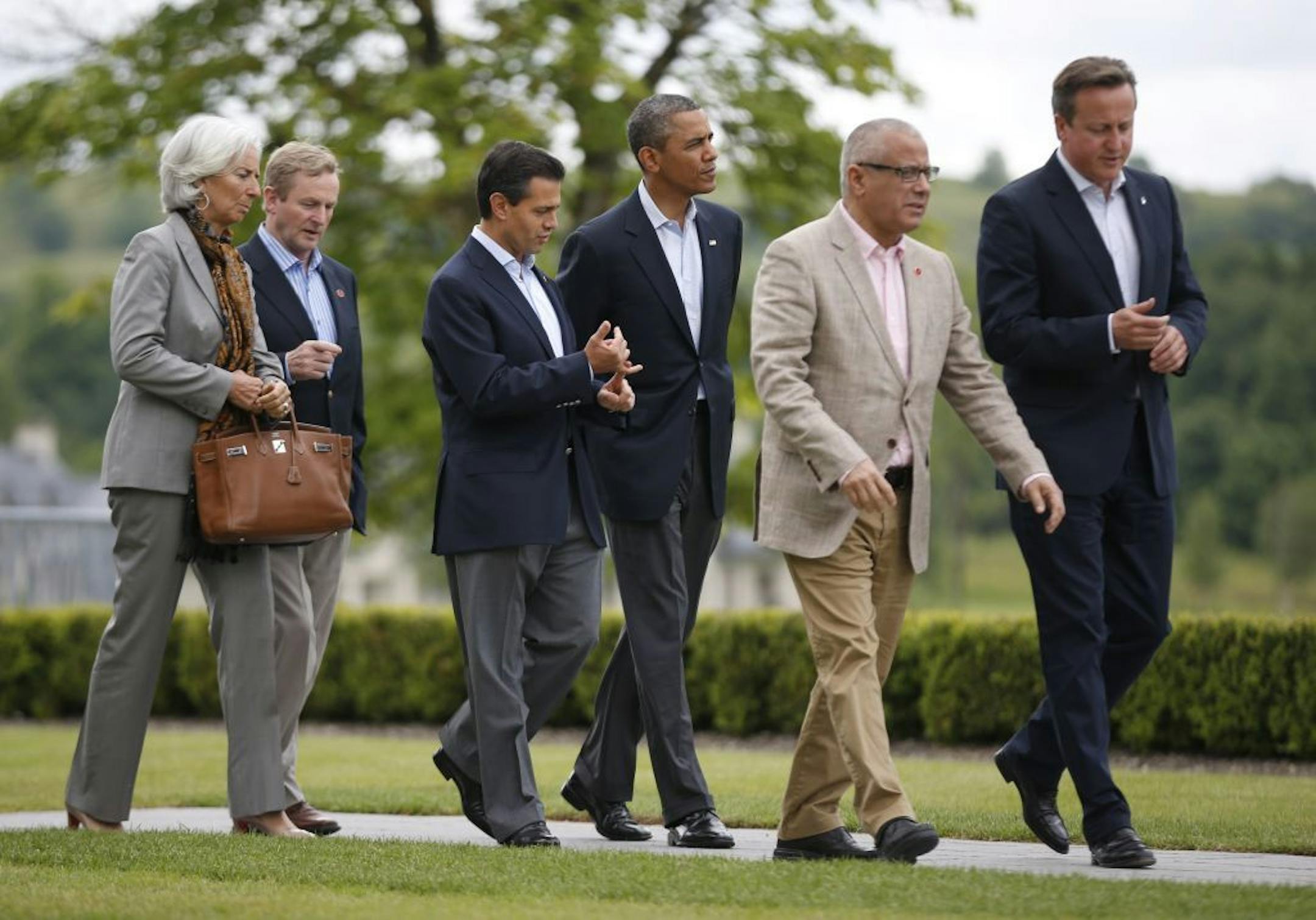 from right, British Prime Minister David Cameron, Libyan Prime Minister Ali Zeidan, US President Barack Obama, Mexican President Enrique Pena Nieto, Irish Prime Minister Enda Kenny and Managing Director of the International Monetary Fund Christine Lagarde walk to a lunch event at the G-8 summit at the Lough Erne golf resort in Enniskillen, Northern Ireland, on Tuesday, June 18, 2013. The final day of the G-8 summit of wealthy nations is ending with discussions on globe-trotting corporate tax dod
