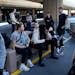 Players and staff of the New York Liberty wait to board buses at Harry Reid International Airport last season in Las Vegas. The wait for full-time cha