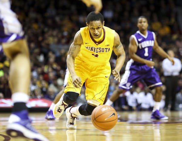 Gophers Deandre Mathieu ran for a loose ball during the first half.