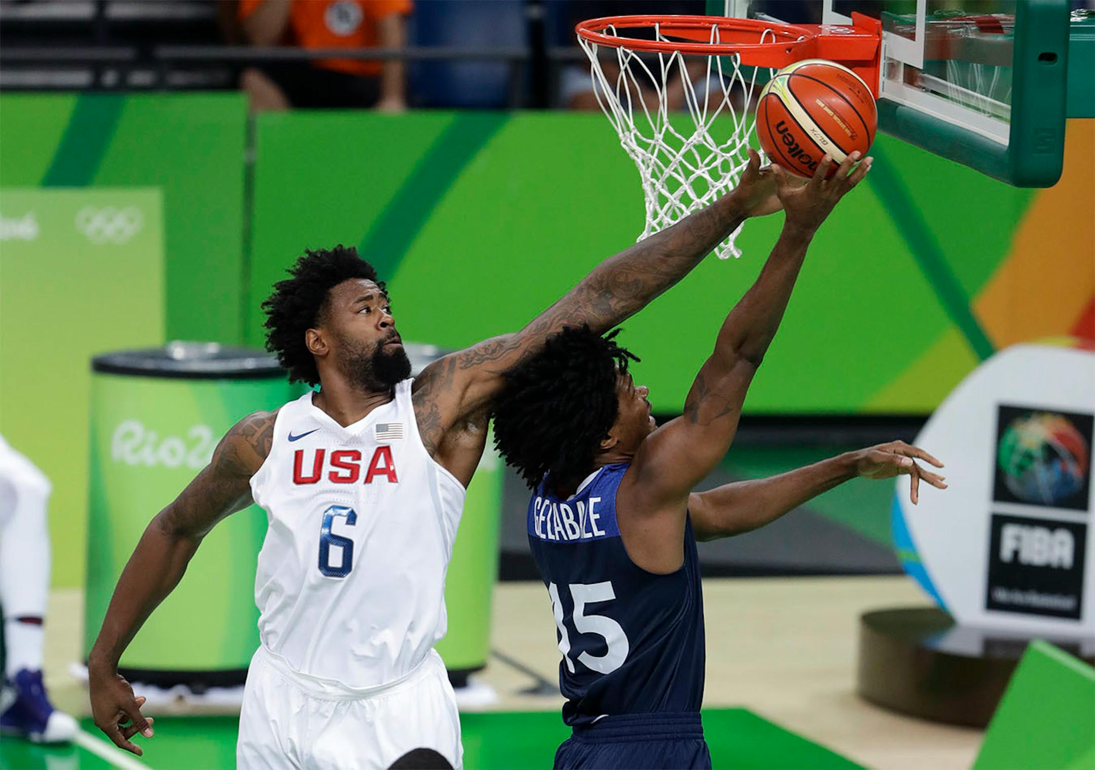 France's Mickael Gelabale (15) drives to the basket past United States' DeAndre Jordan (6) during a men's basketball game at the 2016 Summer Olympics in Rio de Janeiro, Brazil, Sunday, Aug. 14, 2016.