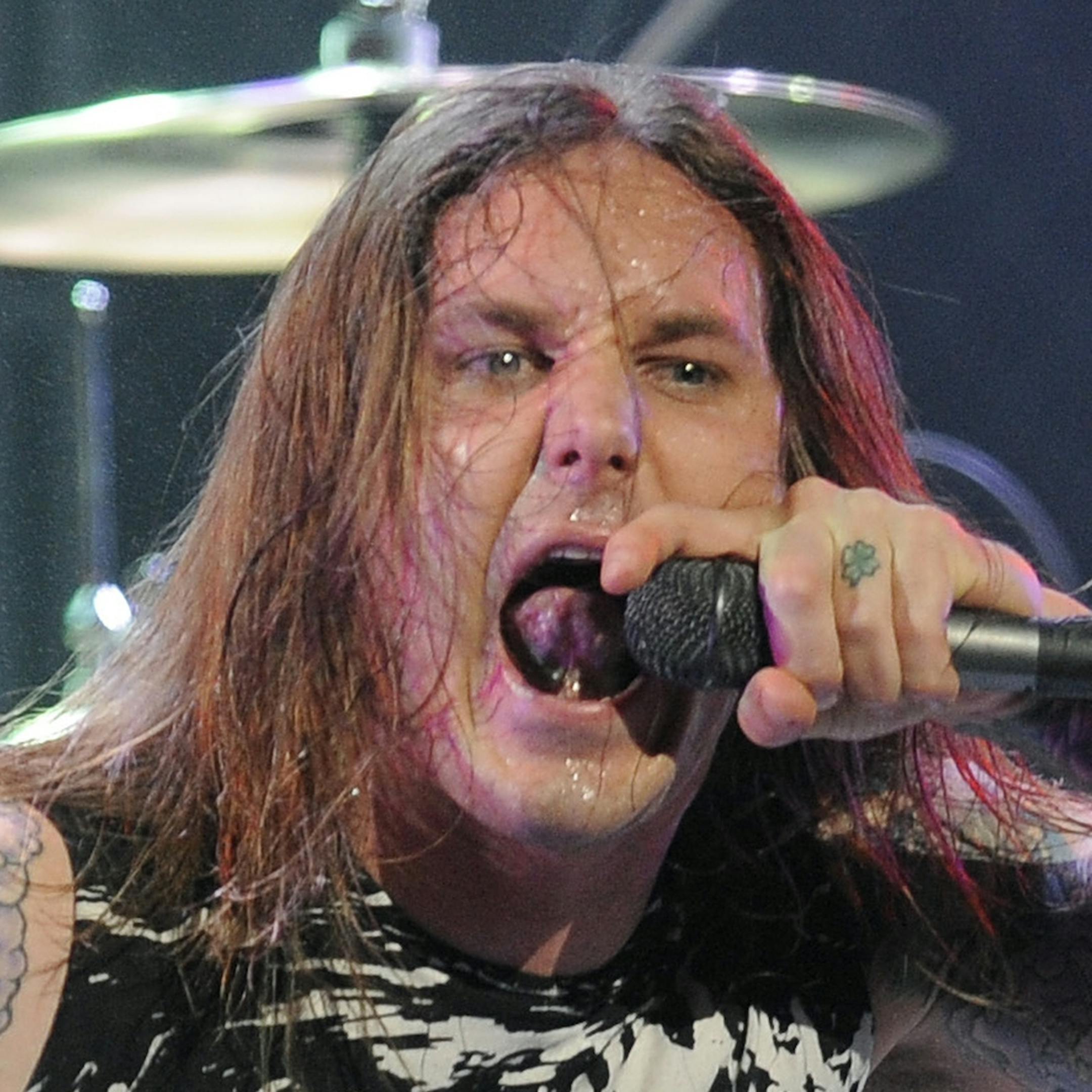 FILE - In this file photo taken Thursday, April 8, 2010, Tim Lambesis of As I Lay Dying performs at the second annual Revolver Golden Gods Awards in Los Angeles. Authorities say the singer of Grammy-nominated heavy metal band As I Lay Dying has been arrested Tuesday May 7, 2013 in Southern California after trying to hire an undercover detective to kill his estranged wife. The San Diego County Sheriffís Department says in a statement that 32-year-old Tim Lambesis was arrested Tuesday in Ocea