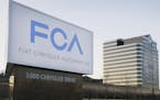 FILE - This Tuesday, May 6, 2014, file photo shows a sign outside Fiat Chrysler Automobiles world headquarters in Auburn Hills, Mich. In a lawsuit fil