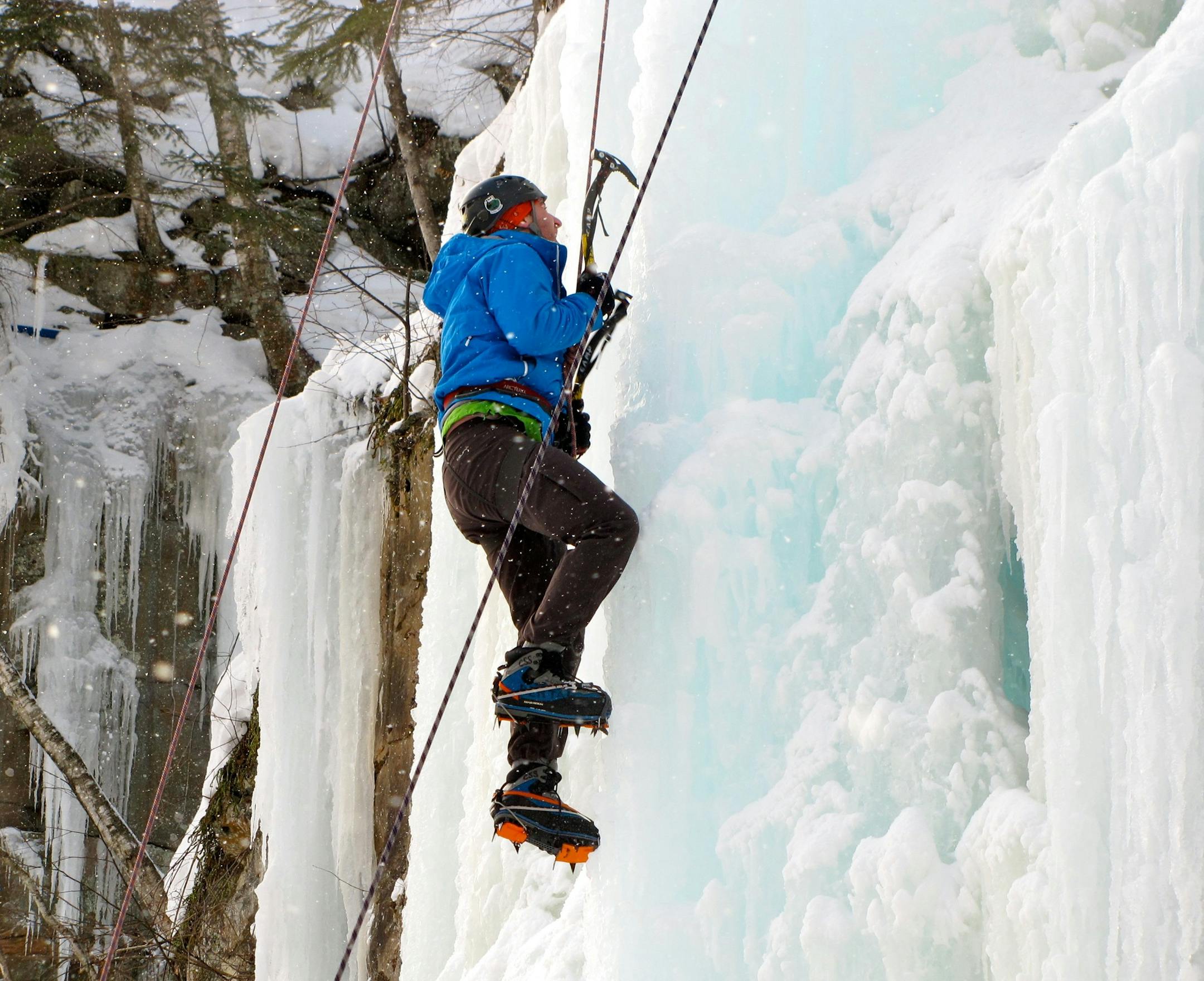 Photo by Lisa Meyers McClintick. First-time and experienced ice climbers can be found scaling the icy walls of Sandstoneís Robinsonís Quarry on weekends throughout the winter.