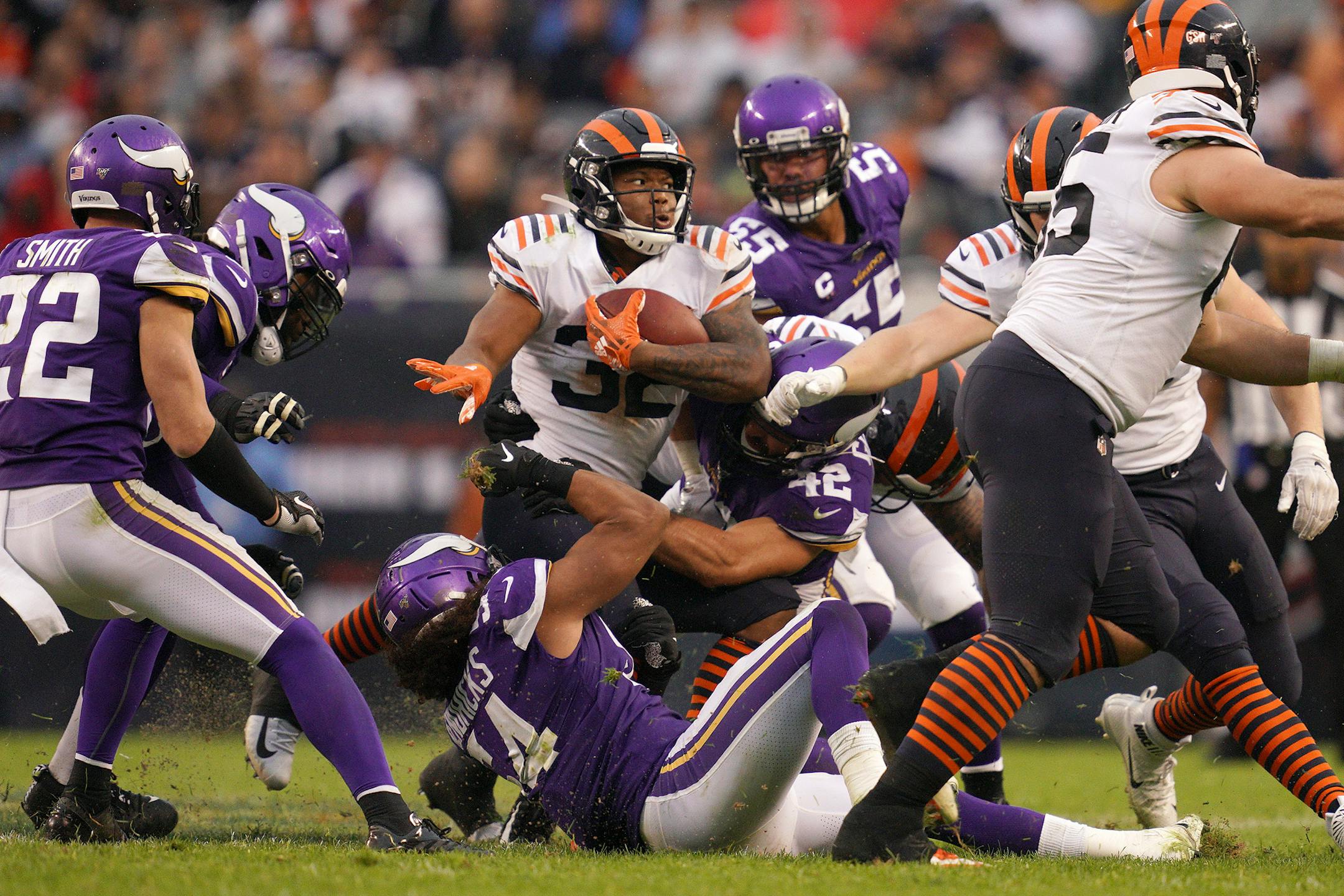 Chicago Bears running back David Montgomery (32) was brought down by Minnesota Vikings middle linebacker Eric Kendricks (54) and outside linebacker Ben Gedeon (42) as he ran the ball in the fourth quarter. ] ANTHONY SOUFFLE • anthony.souffle@startribune.com The Minnesota Vikings played the Chicago Bears in an NFL football game Sunday, Sept. 29, 2019 at Soldier Field in Chicago.