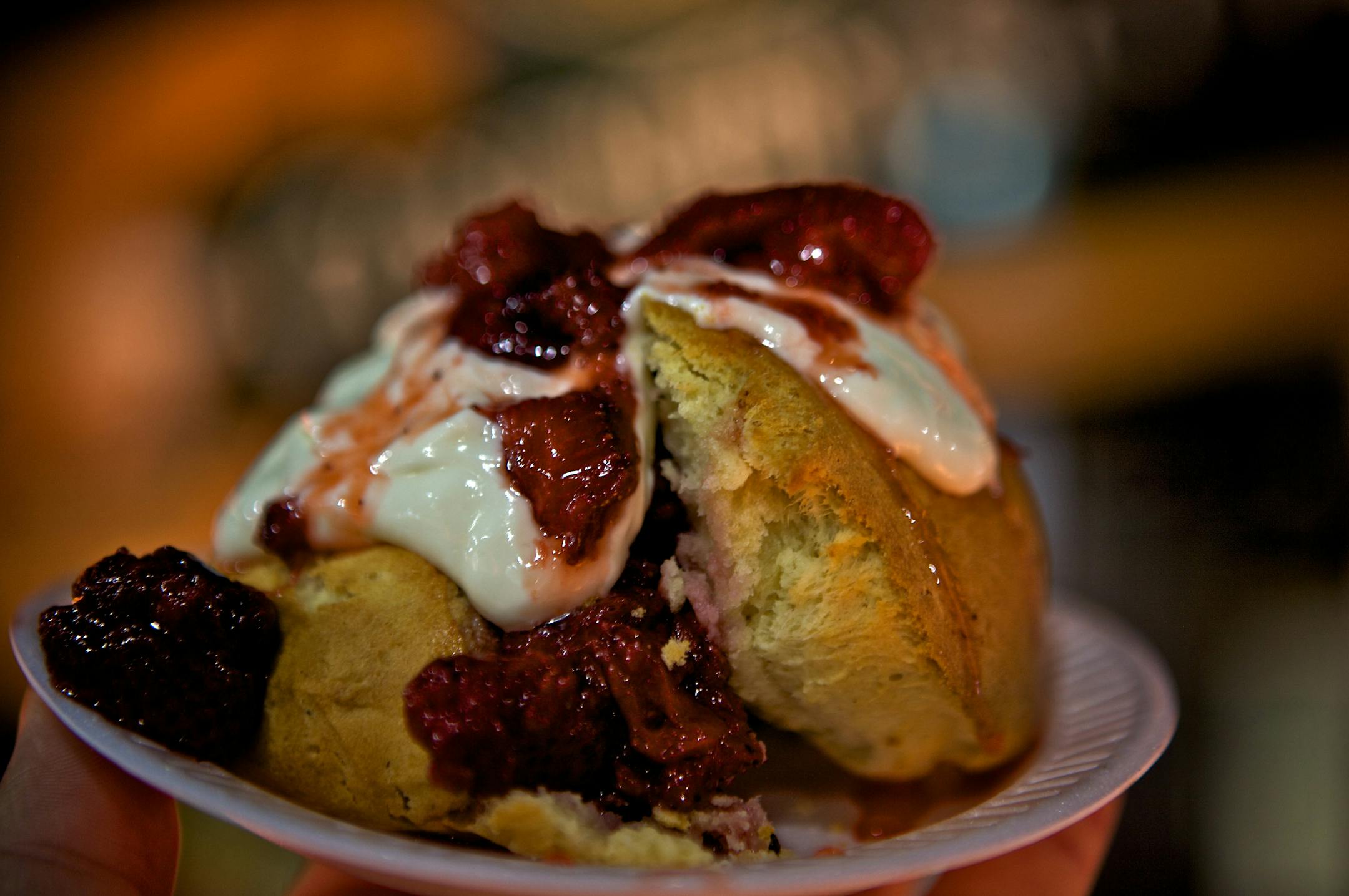 A scone with strawberries and cream from Country Scones & Coffee.