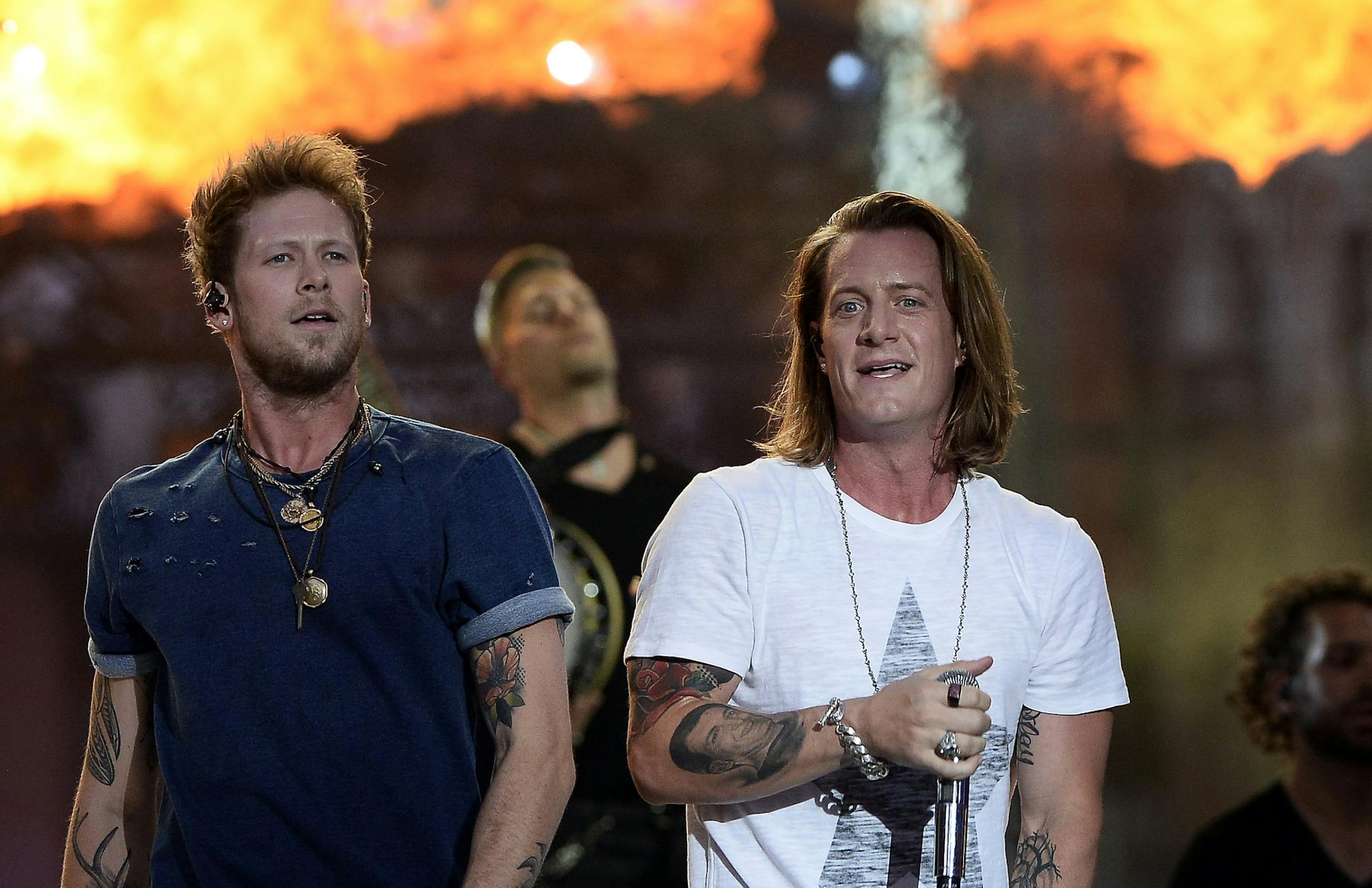 Brian Kelley, left, and Tyler Hubbard of Florida Georgia Line perform on an outdoor stage during the CMT Music Awards on Wednesday, June 10, 2015, in Nashville, Tenn. (Photo by Mark Zaleski/Invision/AP)