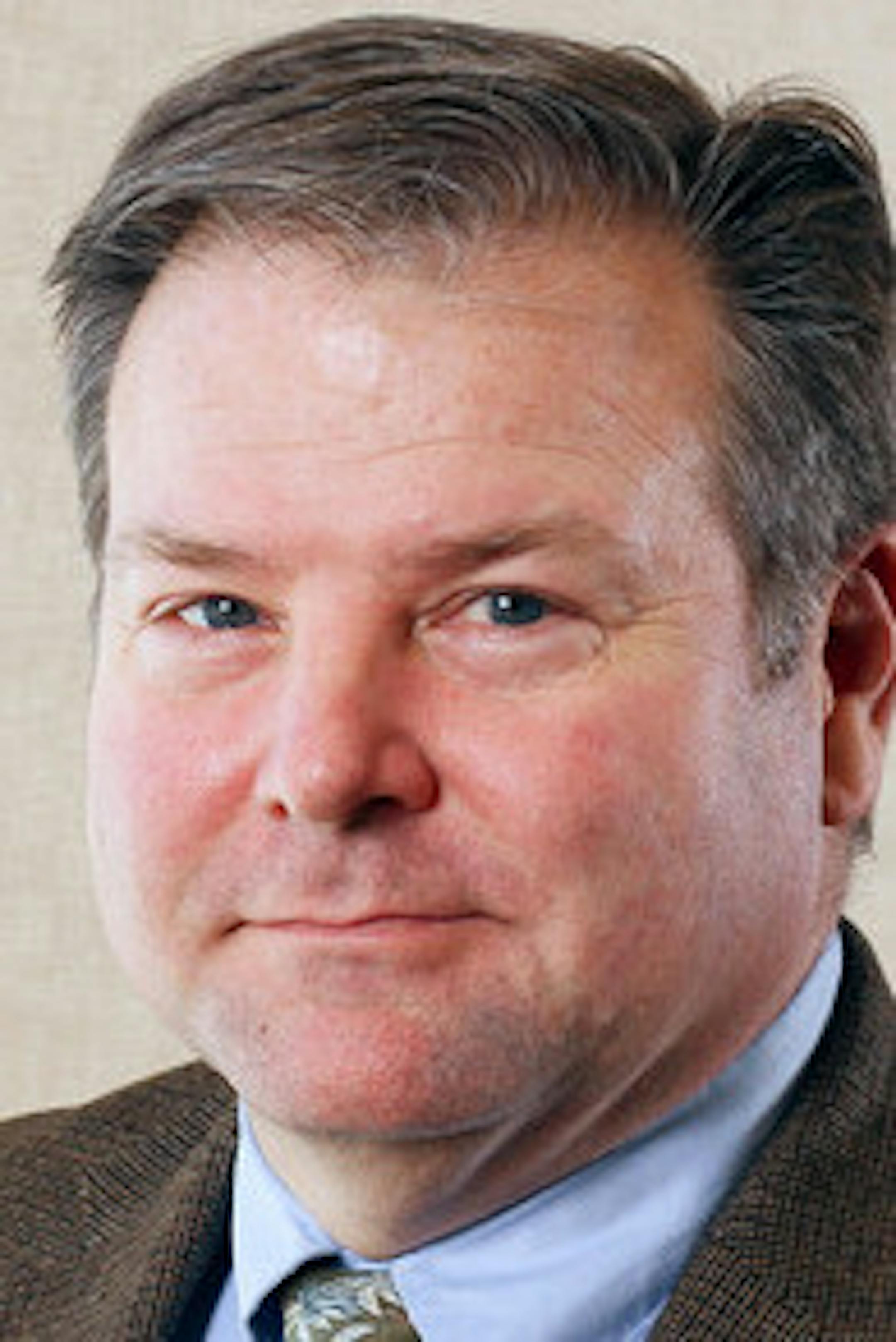 Environmental portrait of Mike Porter taken on Friday, March 8, 2013 on the St. Paul campus of the University of St. Thomas.