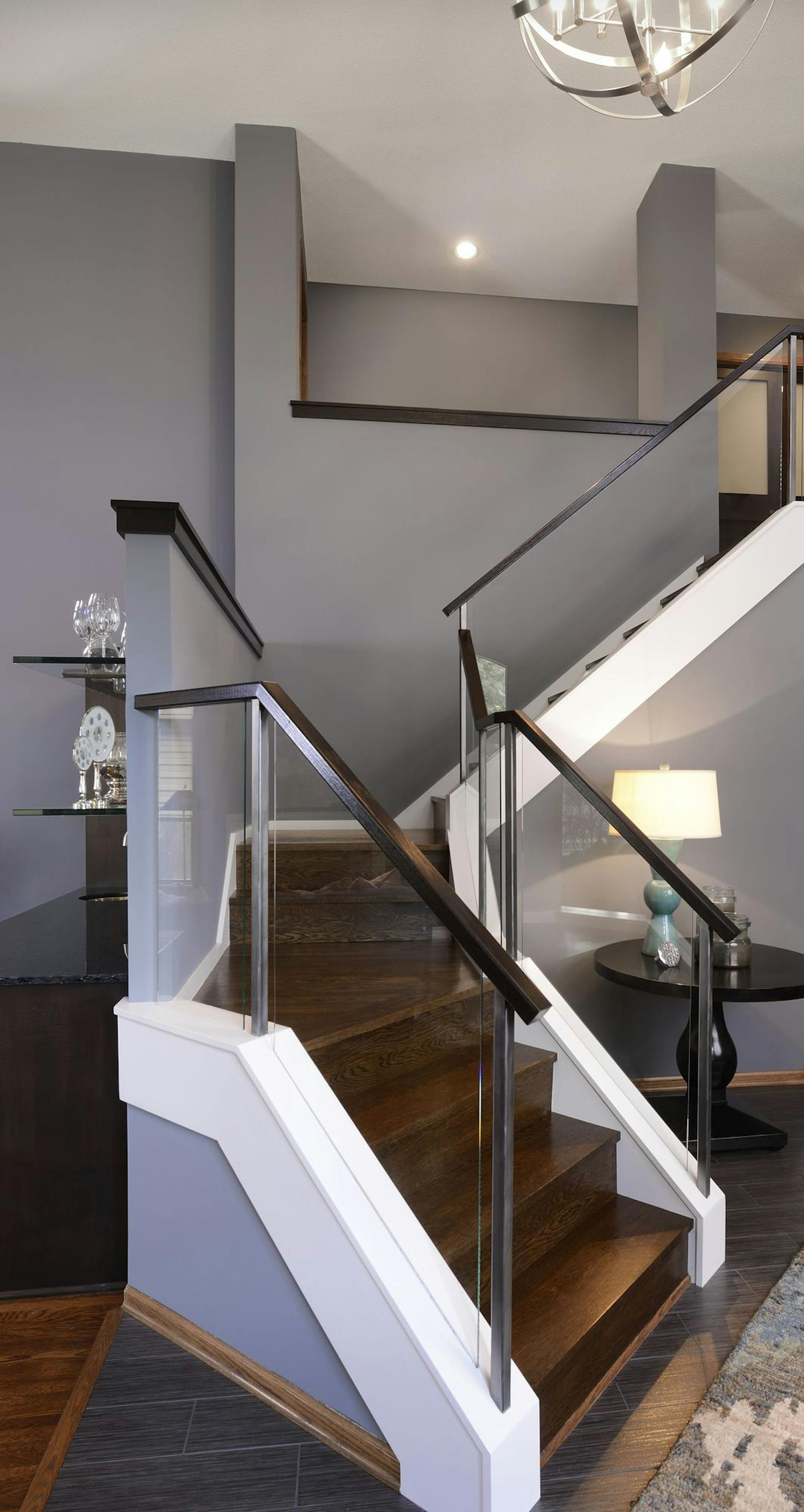 The foyer staircase in a 1980s Minneapolis home got a makeover for a more open look.