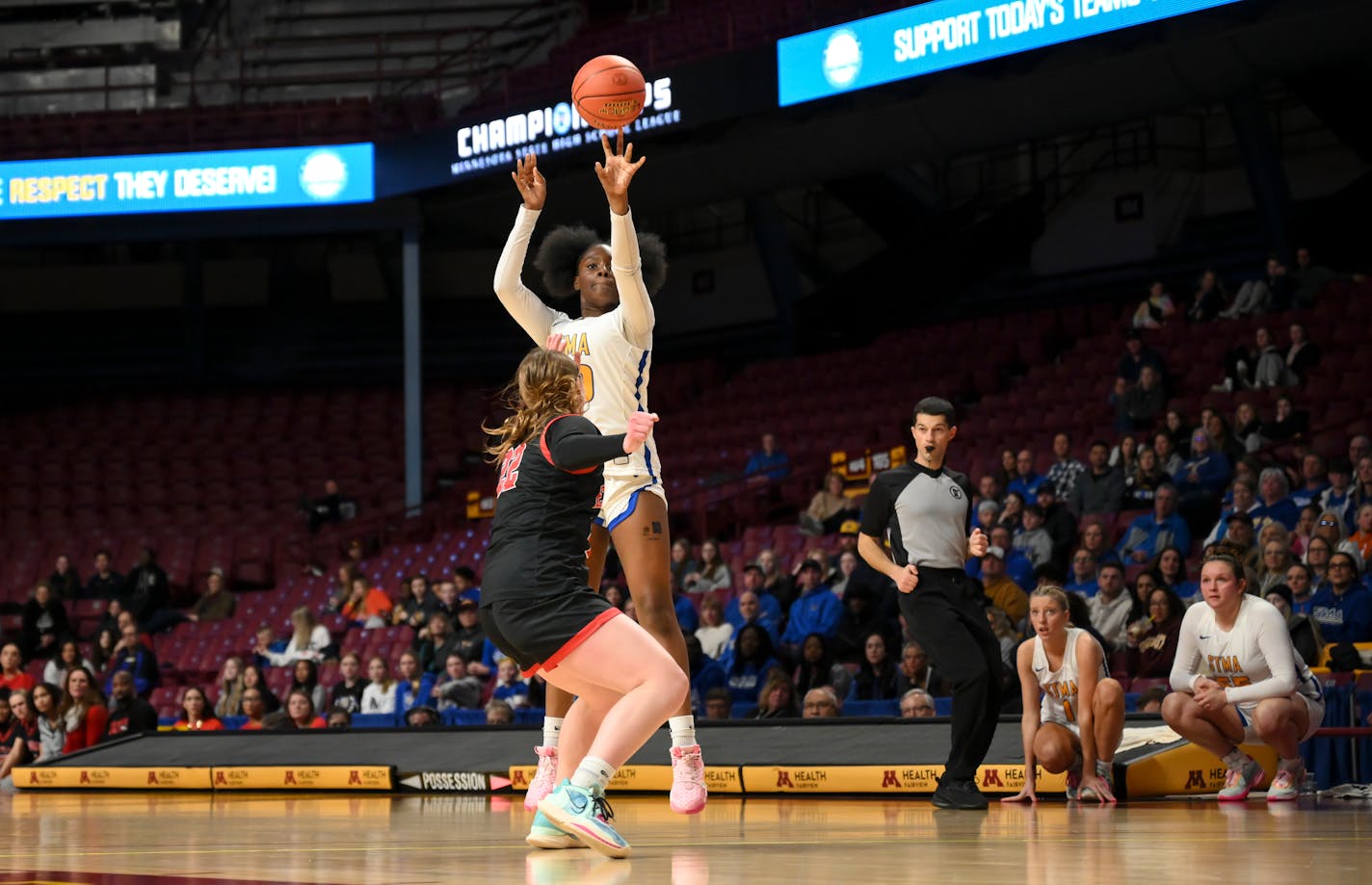 St. Michael-Albertville guard JaKahla Craft (50) hits a 3-pointer against Eden Prairie's Ashley Fritz (22) in the second half Thursday, March 16, 2023 during the Class 4A girls' basketball state tournament semifinals at Williams Arena in Minneapolis, Minn.. ] AARON LAVINSKY • aaron.lavinsky@startribune.com