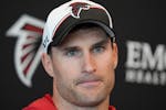 FILE - Atlanta Falcons quarterback Kirk Cousins speaks during a news conference after an NFL football practice Tuesday, May 14, 2024, in Flowery Branc