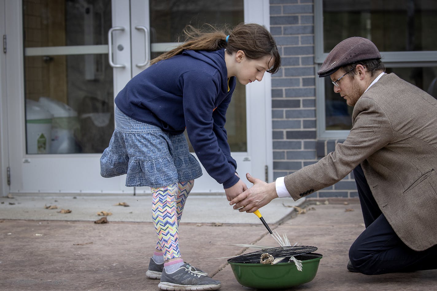 Rabbi Max Davis participated in a pre-Passover ritual with his family, including his daughter Revaya, 10, at Darchei Noam Synagogue, Wednesday, April 8, 2020 in St. Louis Park, MN. The ritual involves burning any foods left over in the synogogue made from wheat, barley, rye or oats which have mixed with water to ferment and rise. It comes in preparation of the first Passover seder Wedneday night. ] ELIZABETH FLORES &#x2022; liz.flores@startribune.com