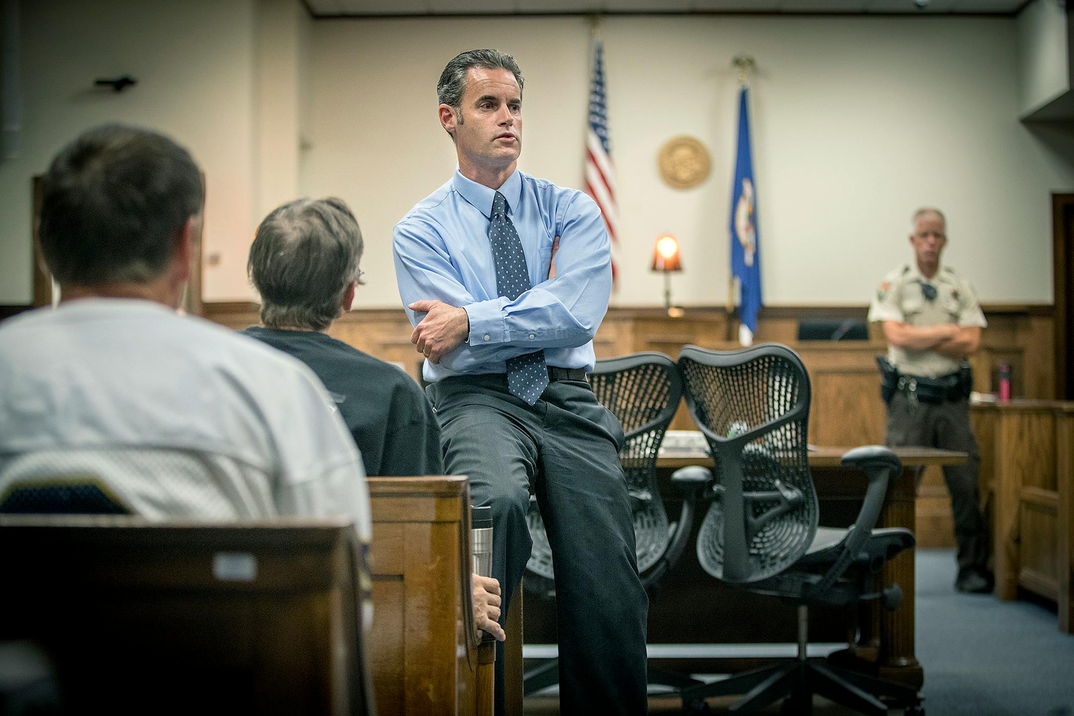 Duluth Judge Shaun Floerke took off his robe and sat close to defendants to check in with them during DWI court, Friday, August 11, 2017 in Duluth, MN.