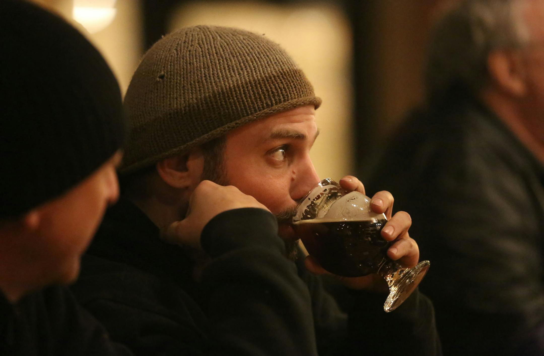 A customer enjoys a drink at a Minneapolis taproom.