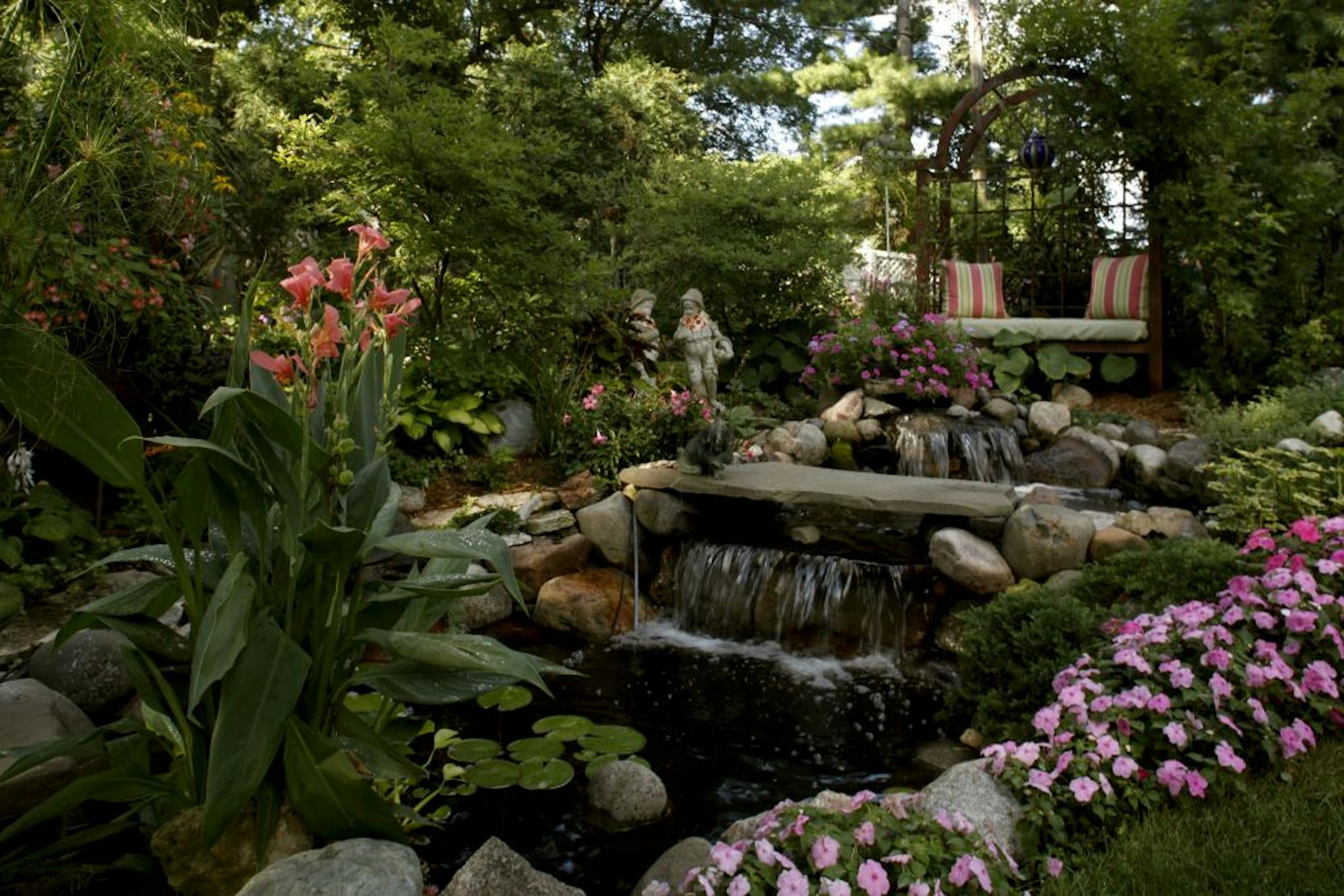 Kevin Blaeser and Cooper Hipp's garden contains many perches from which to view it.