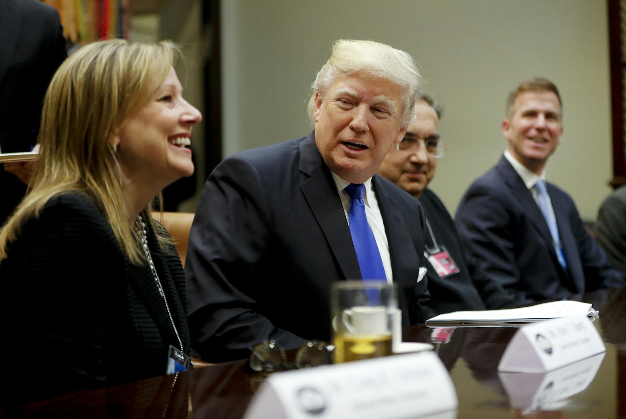 President Donald Trump, center, speaks at the start of a meeting with automobile leaders in the Roosevelt Room of the White House in Washington, Tuesday, Jan. 24, 2017. From left are, General Motors CEO Mary Barra, the president, Fiat Chrysler Automobiles CEO Sergio Marchionne, and Shane Karr, head of External Affairs, Fiat Chrysler Automobiles North America. (AP Photo/Pablo Martinez Monsivais) ORG XMIT: MIN2017012513160437