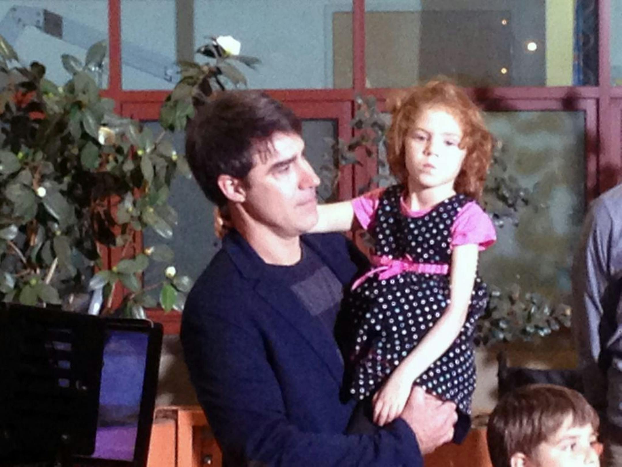 In this photo taken with a mobile phone, Jeff Jarvis of Berkeley, Calif., holds his 4-year-old daughter, Sofia Jarvis, during a news conference at Lucille Packard Children's Hospital at Stanford University on Monday, Feb. 24, 2014, in Palo Alto, Calif.