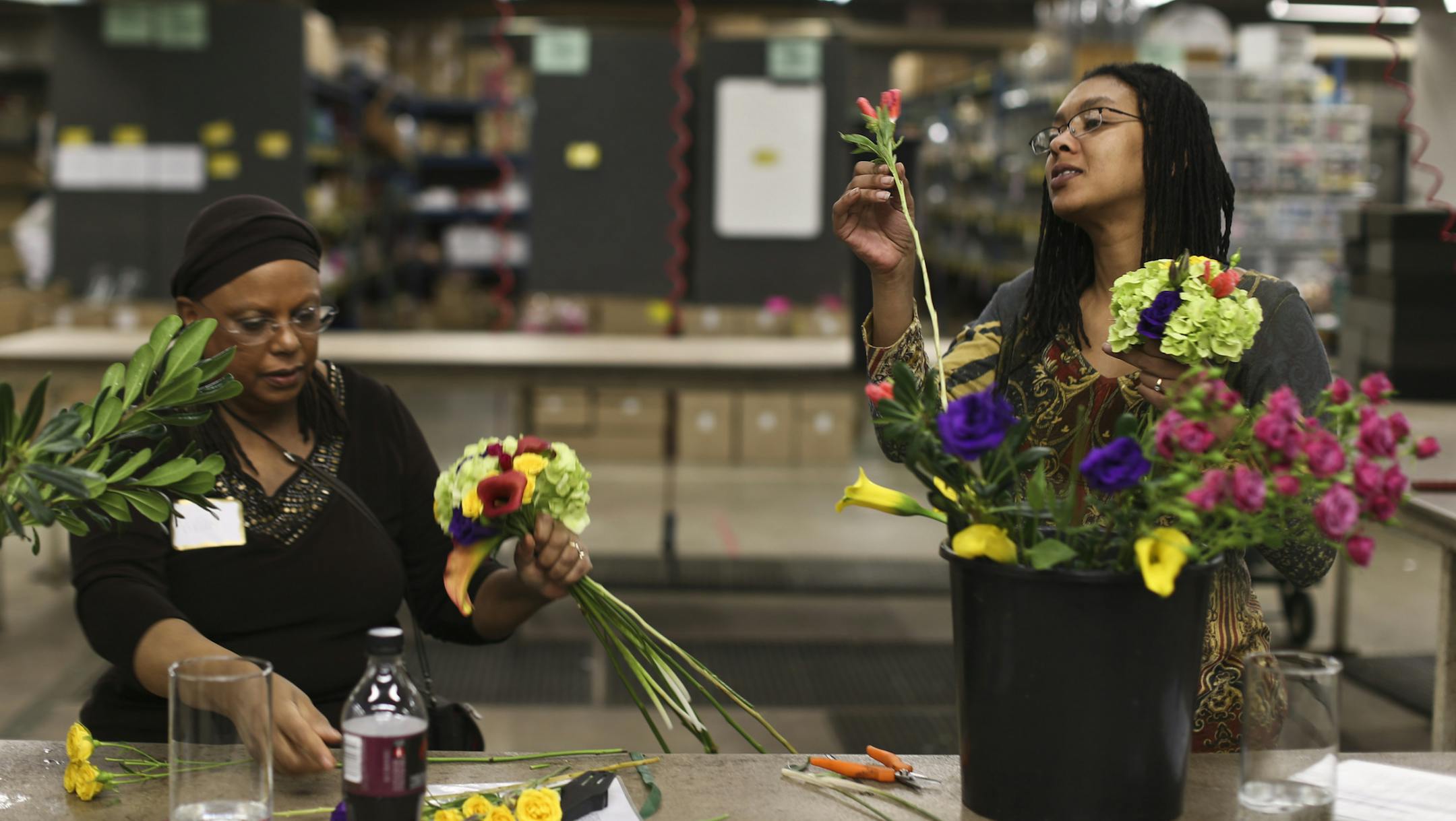Vivian Tanniehill and her daughter Sonja Latimer made bouquets during a DIY bridal flower class at Bachman's in Minneapolis, Minn., on Thursday, March 13, 2014. Tanniehill is planning to make the floral arrangements for her other daughter's (who live's in LA) wedding. ] (RENEE JONES SCHNEIDER &#x2022; reneejones@startribune.com)