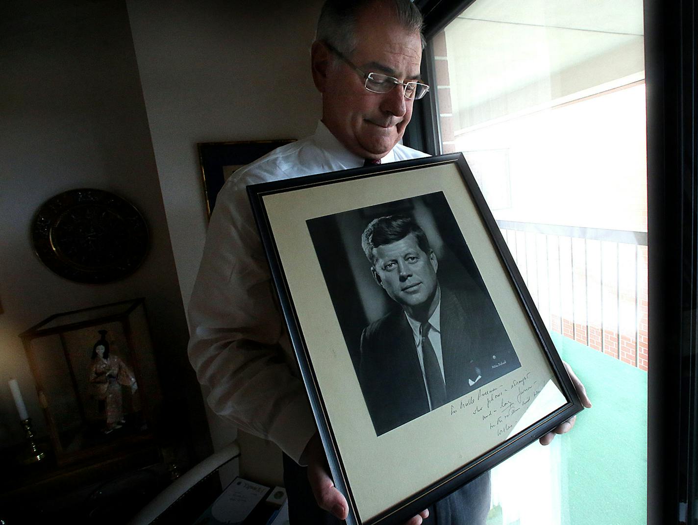 Hennepin County Attorney Mike Freeman held a portrait of President John F. Kennedy that was given to his father, Orville Freeman, then Secretary of Agriculture, but Kennedy. The president gave a photograph to all of his cabinet members, and on Freeman&#x201a;&#xc4;&#xf4;s picture he wrote: &#x201a;&#xc4;&#xfa;To Orville Freeman, who plows a straight and long furrow, with my esteem and very best wishes,&#x201a;&#xc4;&#xf9; John F. Kennedy. ] (JIM GEHRZ/STAR TRIBUNE) / October 22, 2013, Minneapoli