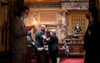 Sen. Ann Rest stopped to talk with Senate Majority Leader Paul Gazelka toward the end of a floor session Wednesday. One week remains for Minnesota leg